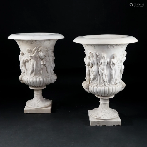 A pair of carved white marble vases