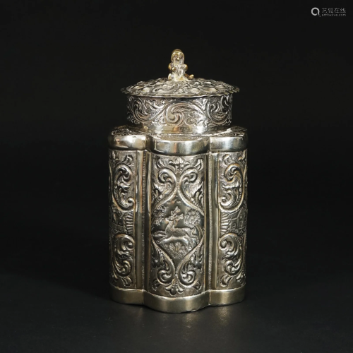 An embossed silver tea caddy