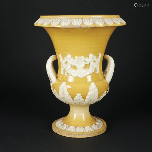An ocher and white maiolica vase, 19th century