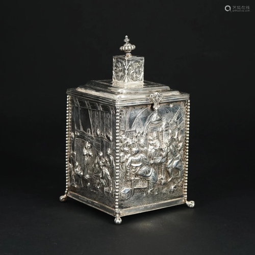 An embossed silver tea caddy