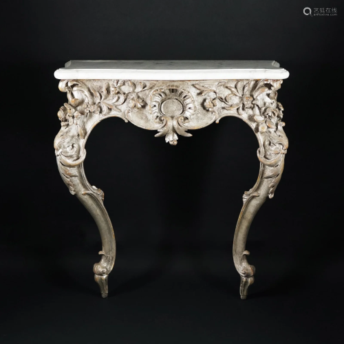 A pair of carved silver wood consoles