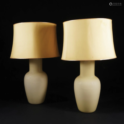 A pair of lamp mounted Murano jacketed yellow blown