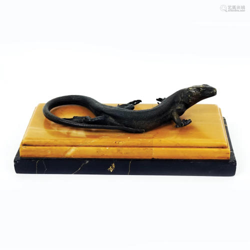 A patinated bronze lizard paperweight