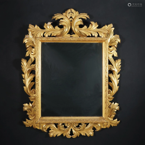 A richly carved gilt wood wall mirror, 19th century