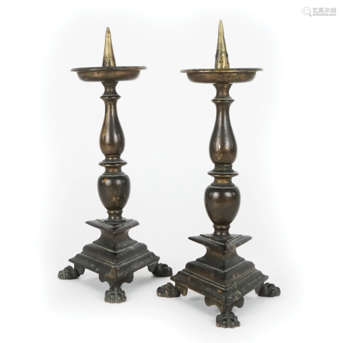 A pair of Tuscan patinated bronze torcieri