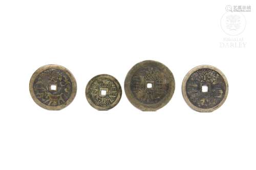 Cuatro monedas chinas en bronce.