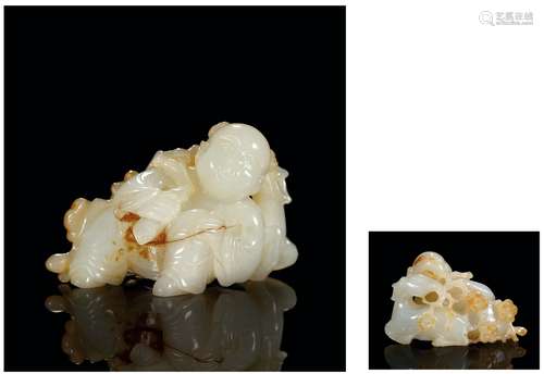 清 白玉巧雕婴戏鹿衔花卉把件