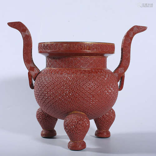 Qianlong red three legged stove in Qing Dynasty