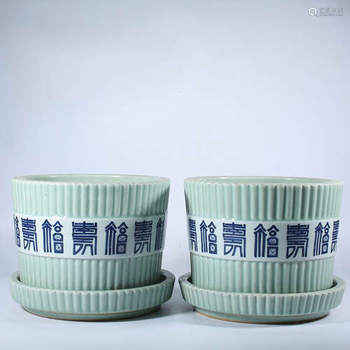 A pair of Qing Dynasty green glazed flowerpots