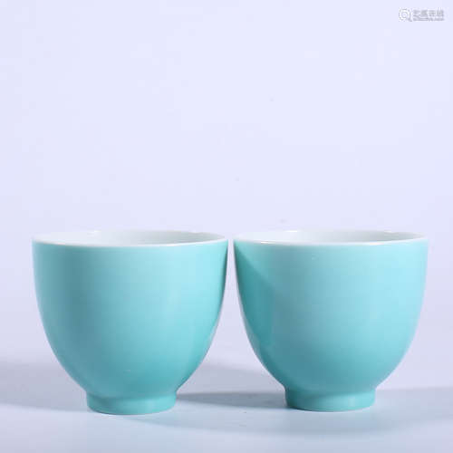 A pair of Qing Dynasty Qianlong pine stone green glazed cups