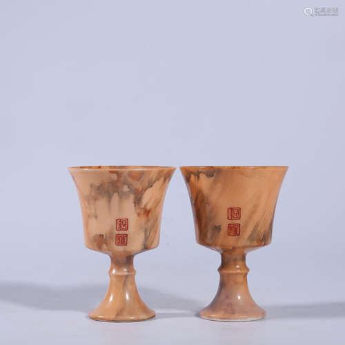 A pair of imitation stone glazed wine glasses in the Qing Dy...