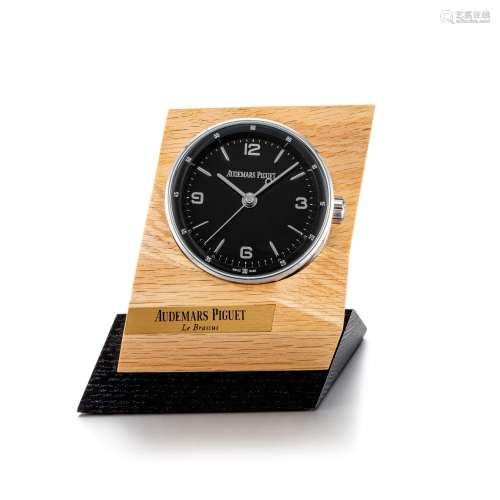 Code 11.59, A stainless steel alarm desk clock with wooden s...