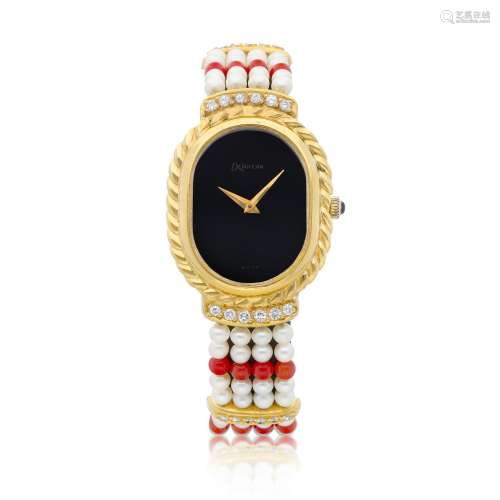 A yellow gold and diamond-set wristwatch with onyx dial and ...