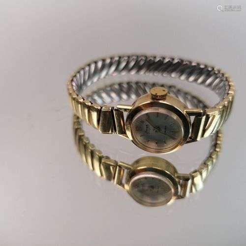 Montre de dame en or jaune 14K sur bracelet métal STOWA. PB:...