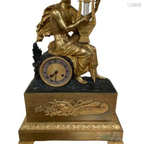 Pendule en bronze doré et patiné représentant Orphée jouant ...