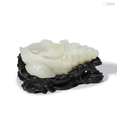 A Carved Jade Buddhist Conch-Form Washer