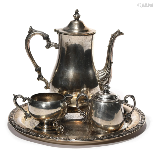 A set of four silver pot, milk jar and plate
