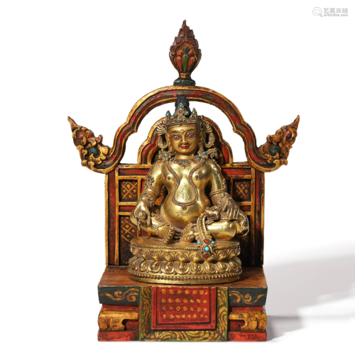 A Gilt Bronze Figure of Buddha with Stand