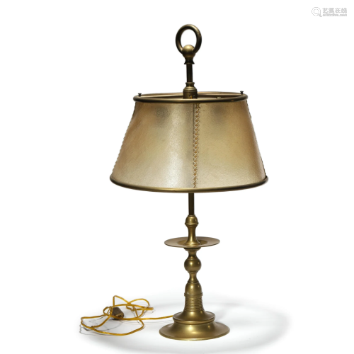 An antique bronze lamp with calfskin lamp shade
