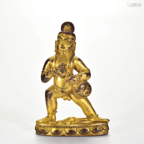 A Tibetan Bronze-gilt Standing Protector