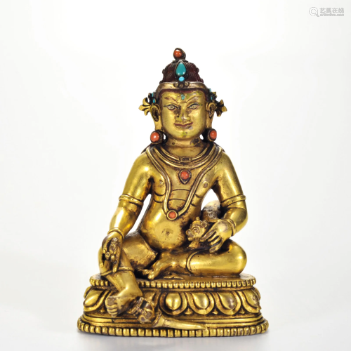 A Tibetan Bronze-gilt Seated Jambhala