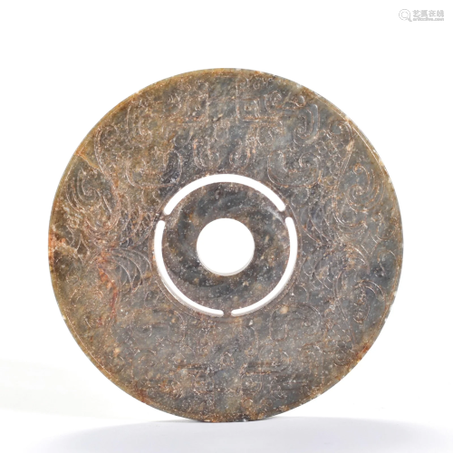 A Carved White Jade Disc Bi Han Dynasty