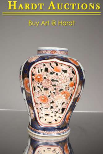 AN OPENWORK IMARI PORCELAIN VASE