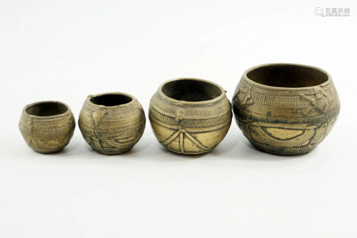 Collection of 4 bronze vessels for measuring liquids