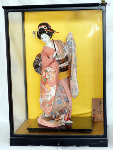 Japanese doll inside an handmade aquarium and