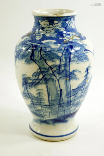 An antique Japanese ceramic vase made by hand, height