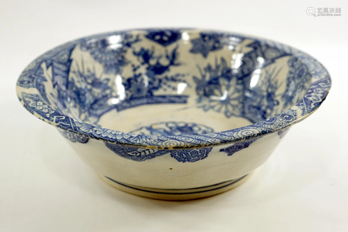 An old Japanese ceramic bowl painted with symbols and