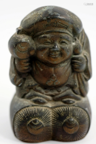 A savings box made of bronze in the shape of a Buddha,