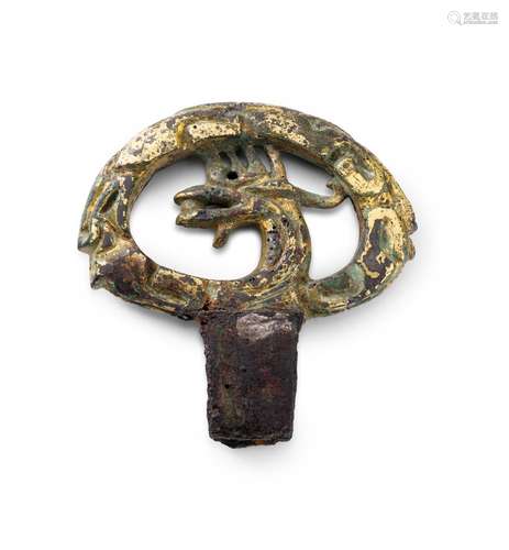 A GILT-BRONZE SWORD POMMEL