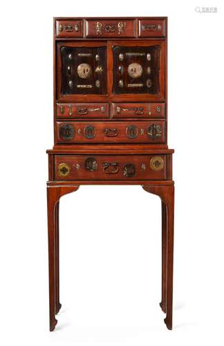 An inlaid hardwood cabinet and stand