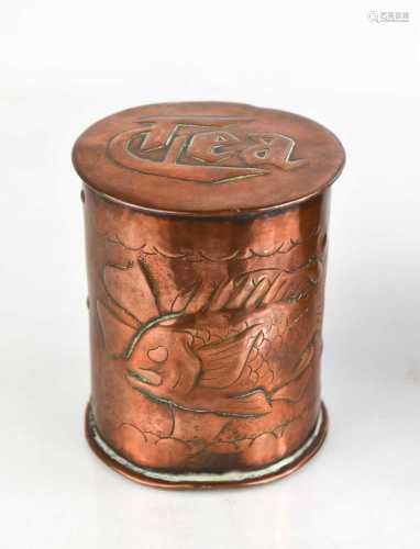 A Newlyn copper tea caddy with embossed fish decoration to t...