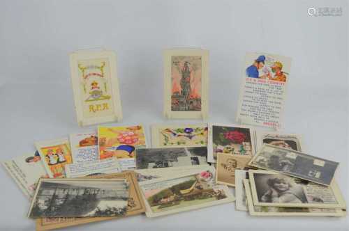 A group of vintage postcards to include three WWI silk examp...