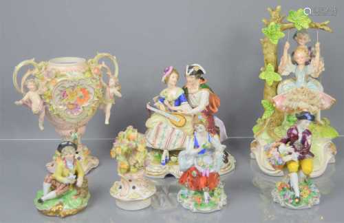 A group of continental porcelain figures and twin handled ur...