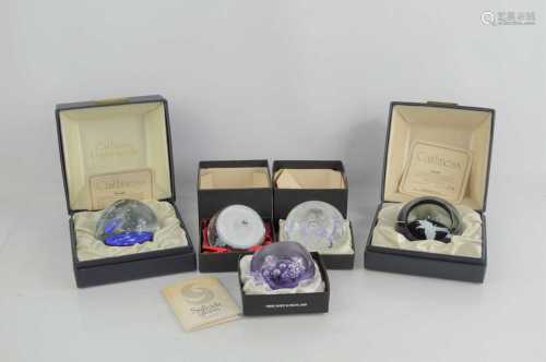 A group of collectible paperweights to include limited editi...