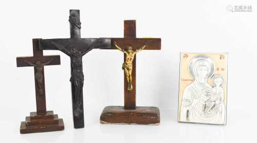 Three crucifixes and an icon.