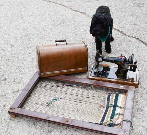 A vintage singer sewing machine and loom