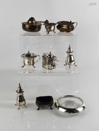 A group of silver to include salt and pepper, salts, mustard...