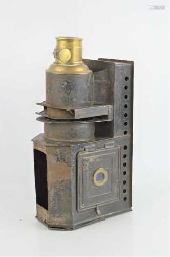 An early 20th century magic lantern with brass lens fitting