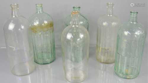 Six large glass poison bottles