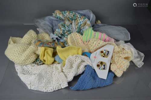 A group of vintage lace, children's and dolls clothes.