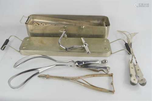 A group of midwifery equipment to include forceps