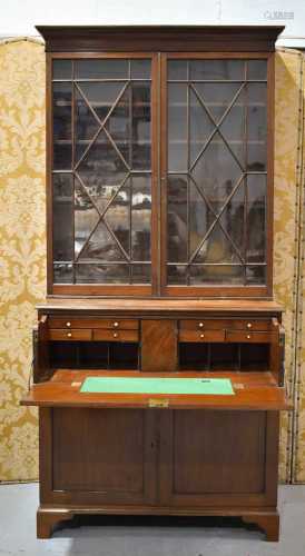 A 19th century mahogany secretaire bookcase, the astrigal gl...