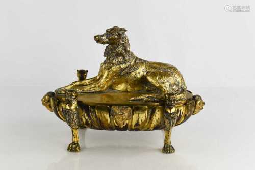 A 19th century gilt bronze inkstand, the cover in the form a...