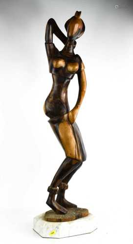 A large hardwood African carved figurine of a woman, 82cm hi...
