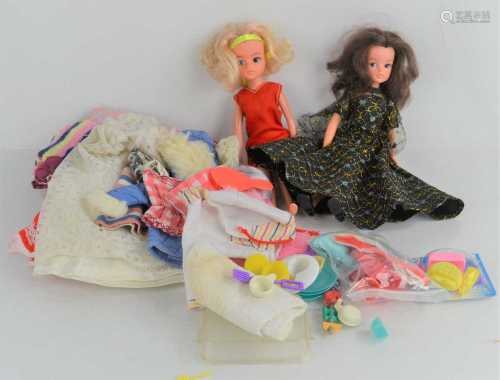 A group of vintage Sindy dolls and clothing