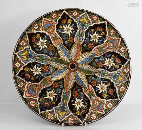A Thoune of Switzerland decorative charger with central fish...